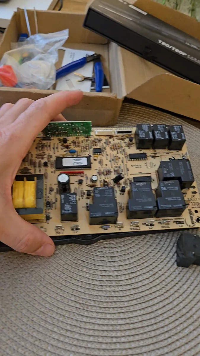 Control board of a DCS by Fisher & Paykel built-in wall oven during bake relay diagnosis in Los Angeles