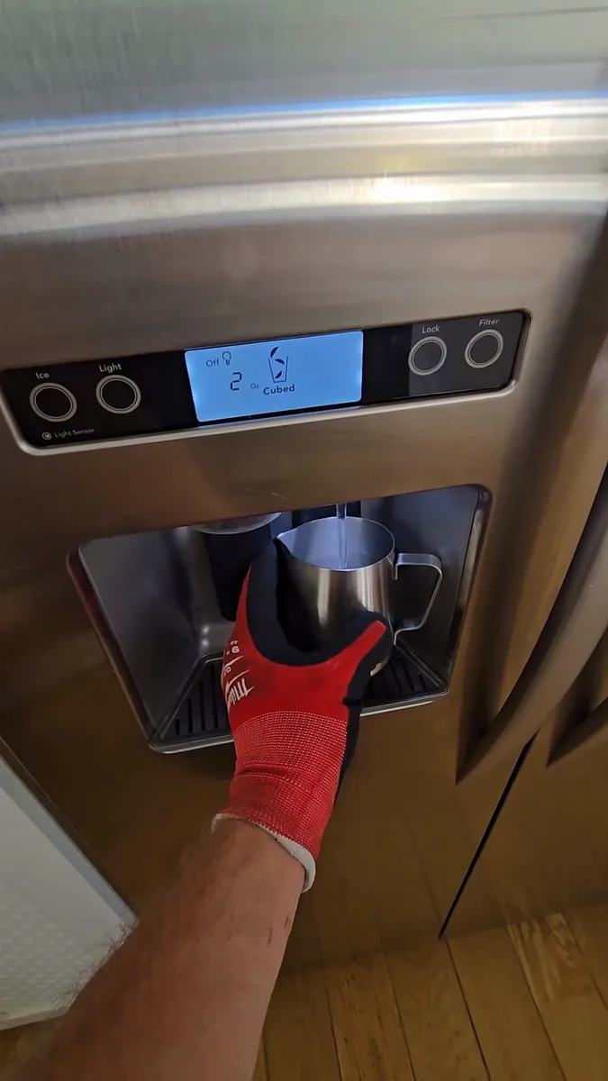Built-in KitchenAid refrigerator water dispenser working correctly after control panel replacement in Los Angeles