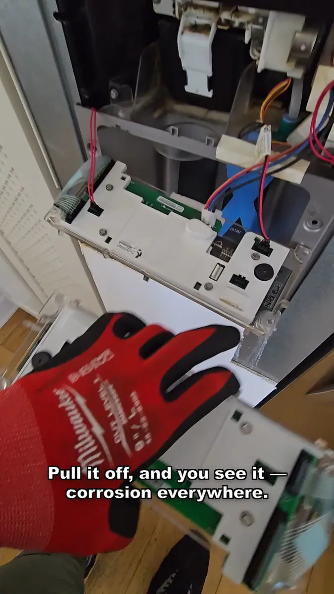 Corroded dispenser control panel removed from the KitchenAid door