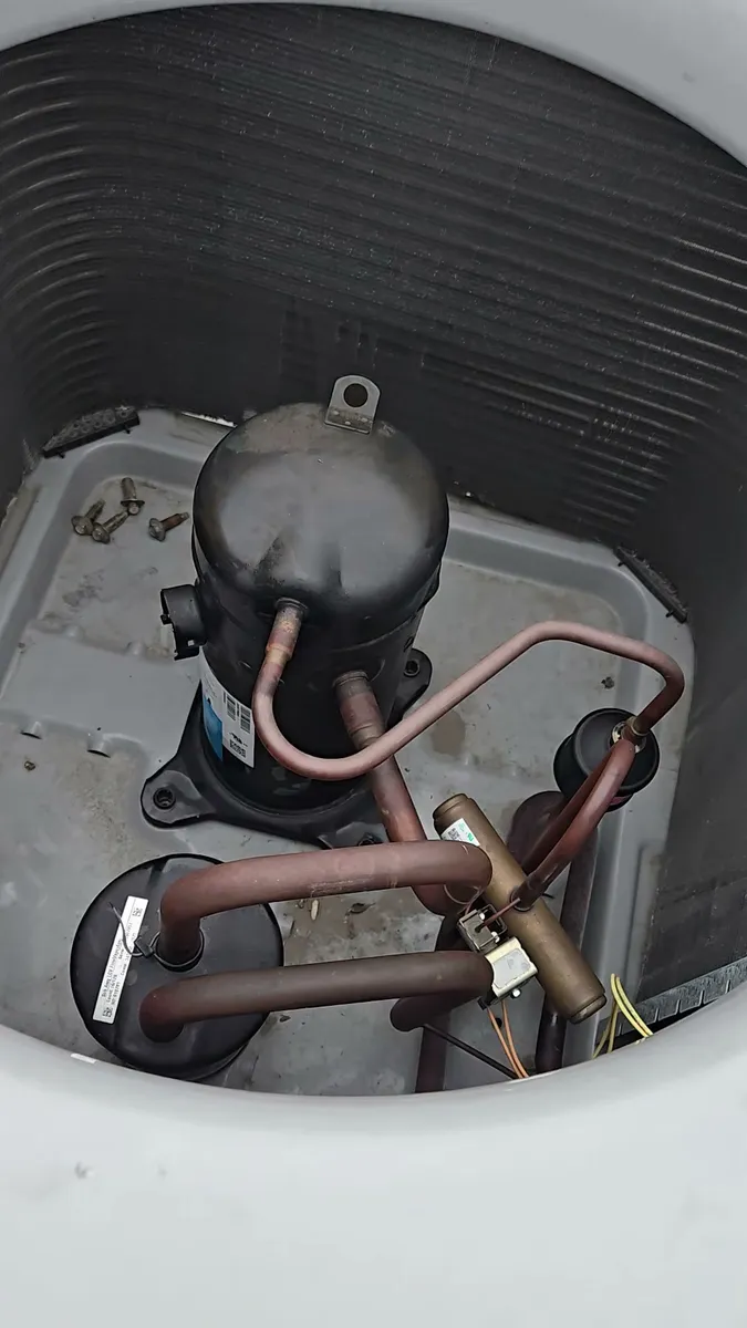 Rooftop condensing unit open during diagnosis and compressor work