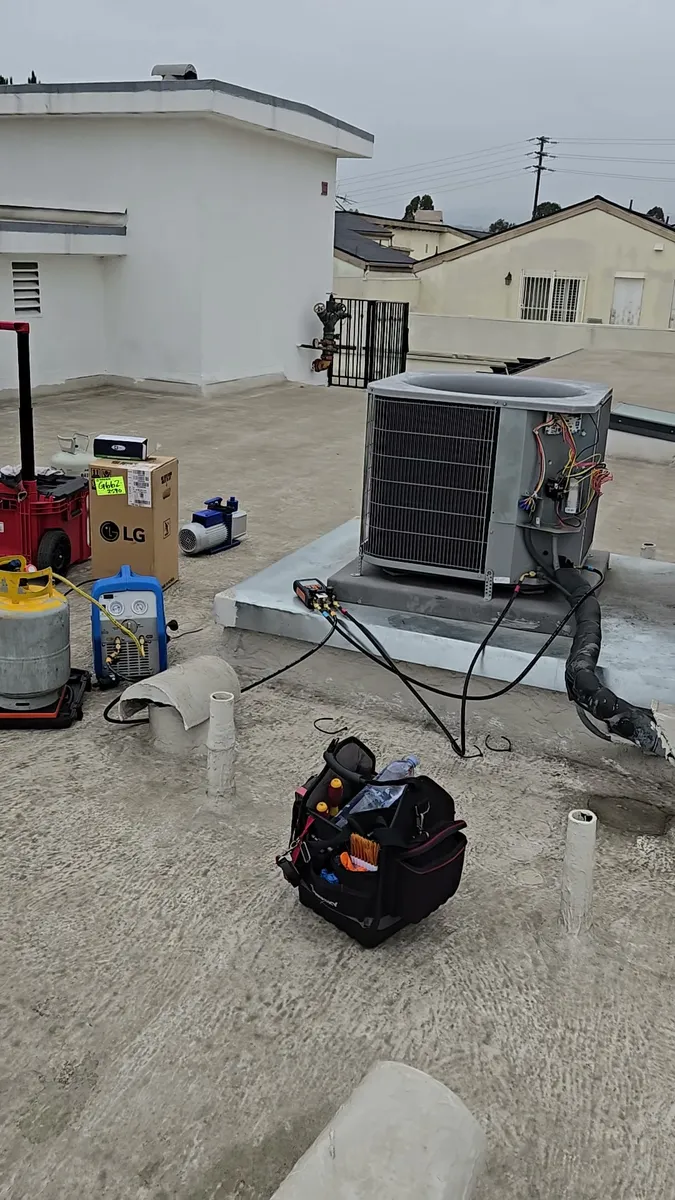 Commercial ICP Central condensing unit on a building rooftop during compressor replacement in Los Angeles