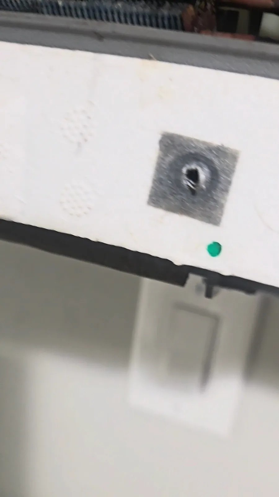 The front of the drain pan on the Daikin mini-split before cleaning, with the front panel off