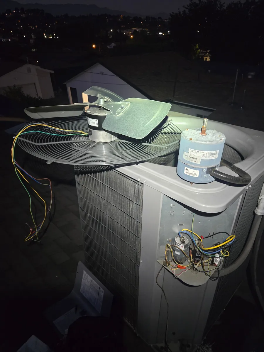 Old and new ECM condenser fan motors on top of an AC condenser during an Epic Star service call in Sherman Oaks, CA