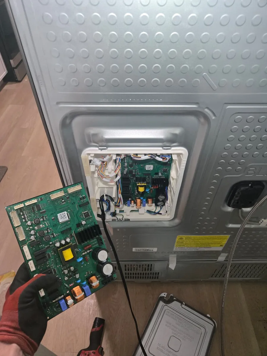 New control board for a Samsung refrigerator held by an Epic Star technician in Venice, CA